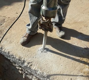 Workers use Concrete Breaker Electric
