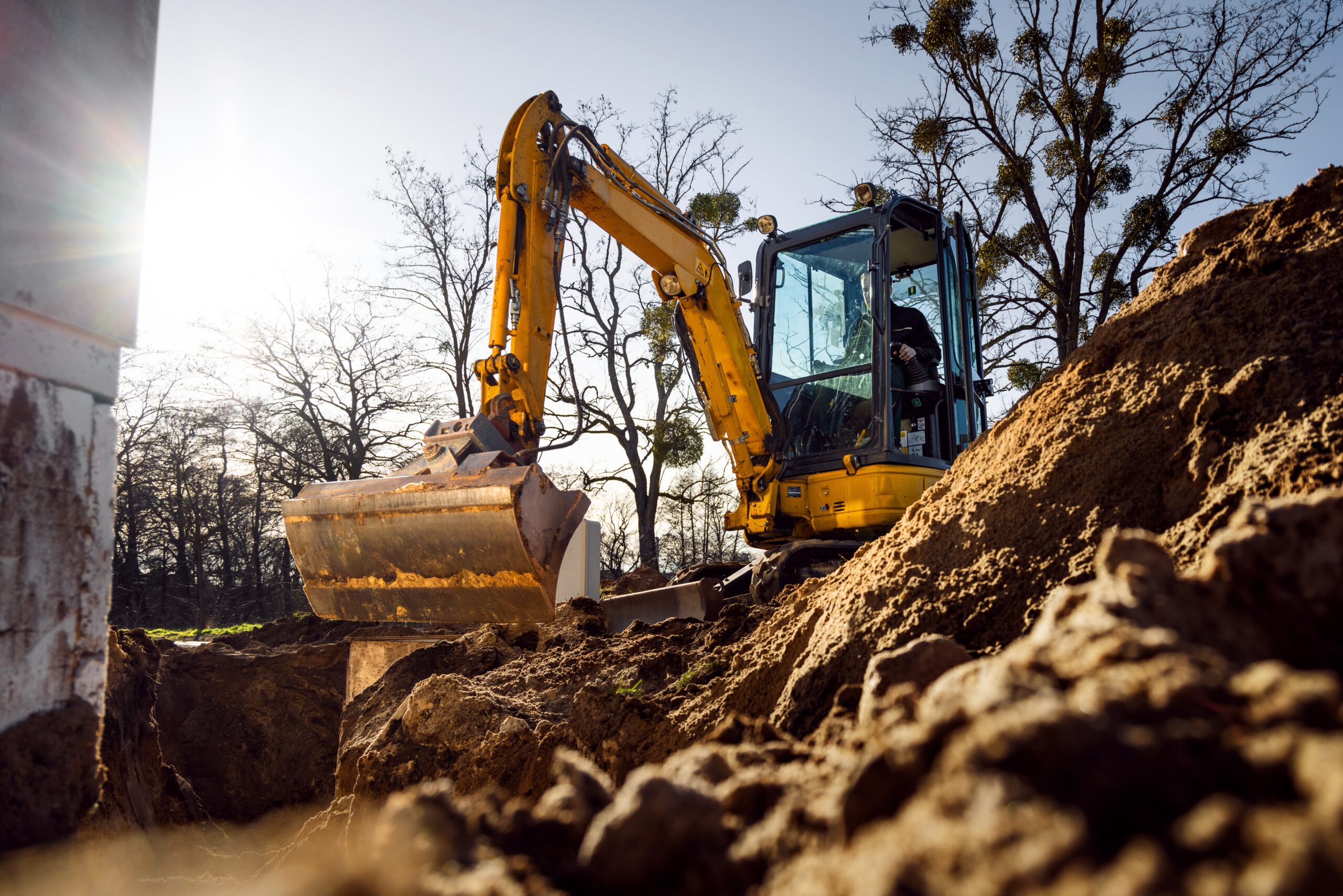 trs equipment rental rented mini excavator working on a construction site