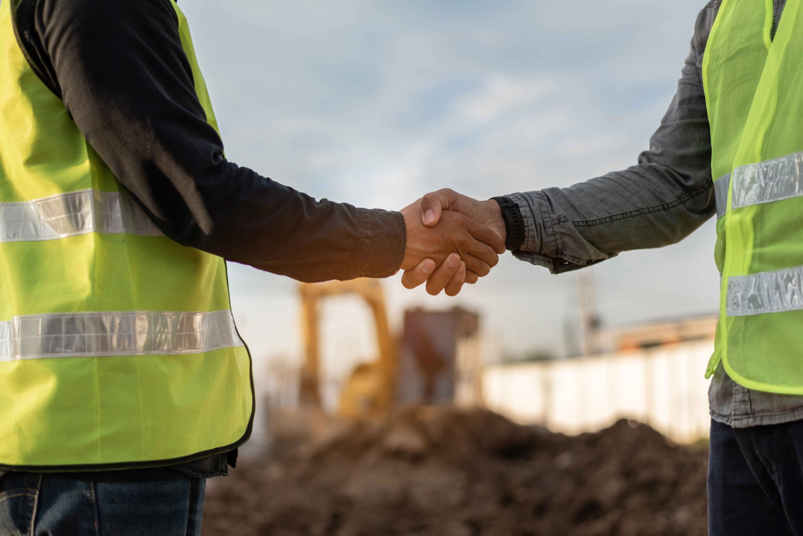 two men shaking hands after exchanging project management tips