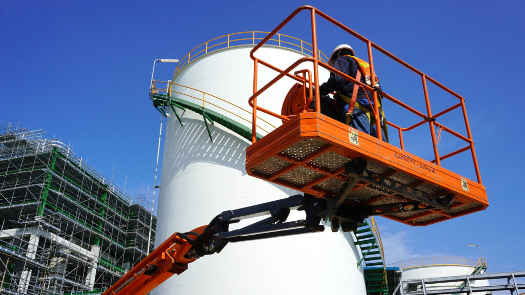 a man on a rented aerial lift from trs equipment rental working on a site