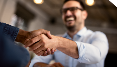 a person shaking hand happily after renting equipment from trs equipment rental