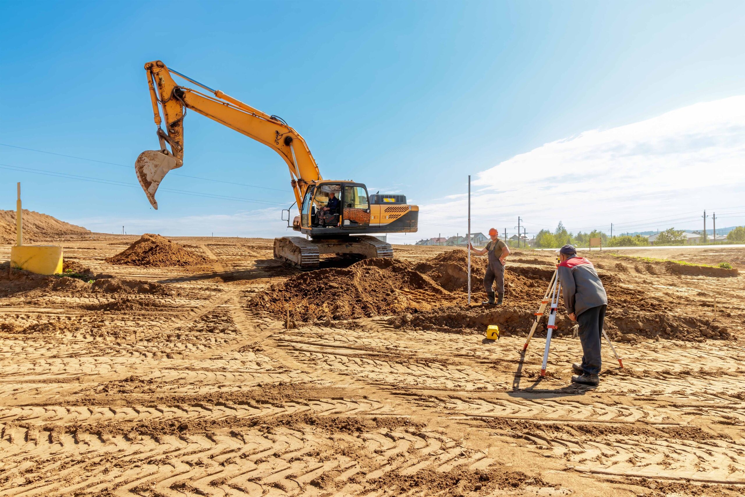 workers working on a site by renting excavators in tucson