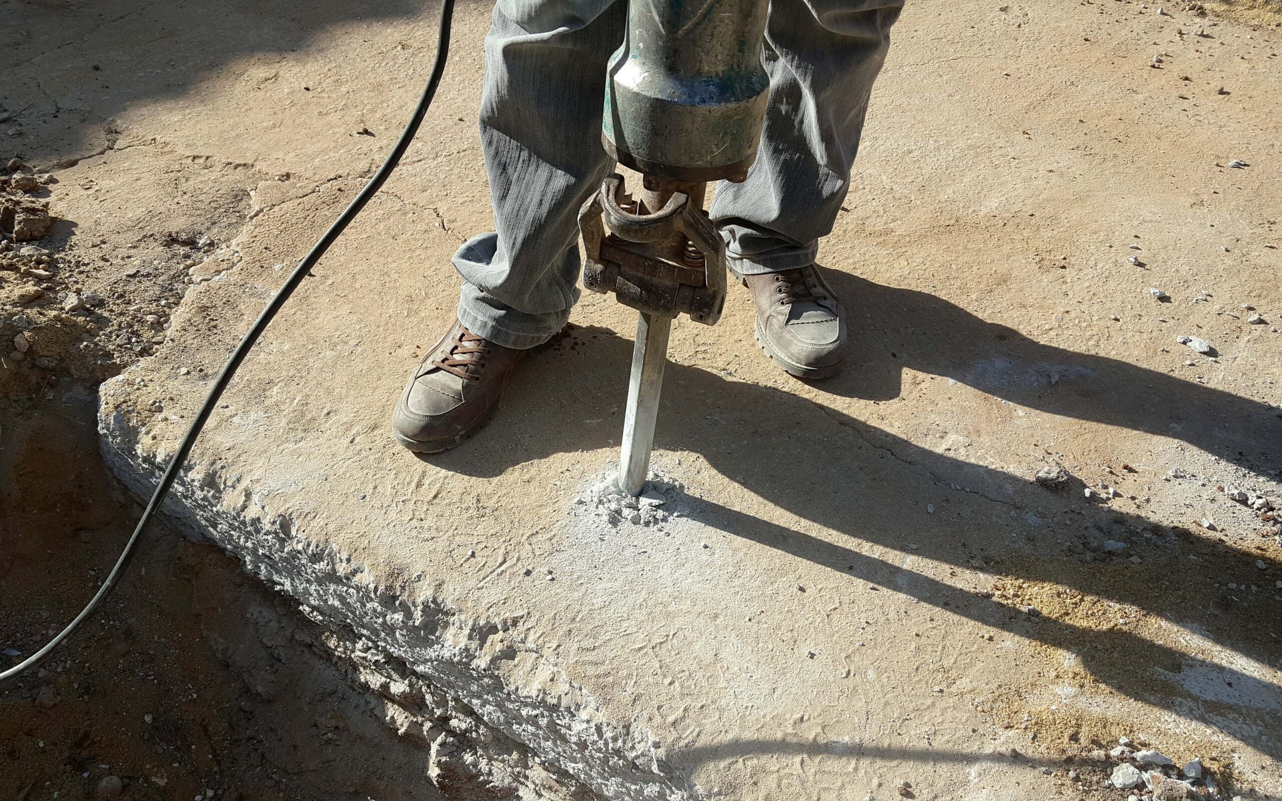 Workers use Concrete Breaker Electric