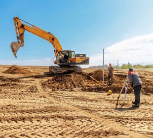 workers working on a site by renting excavators in tucson