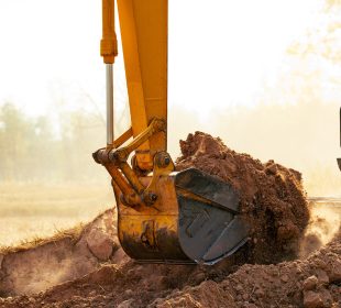 rental excavator digging the land in tucson