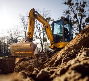 Mini Excavator Rental digging on a job site