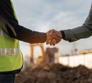 two men shaking hands after exchanging project management tips